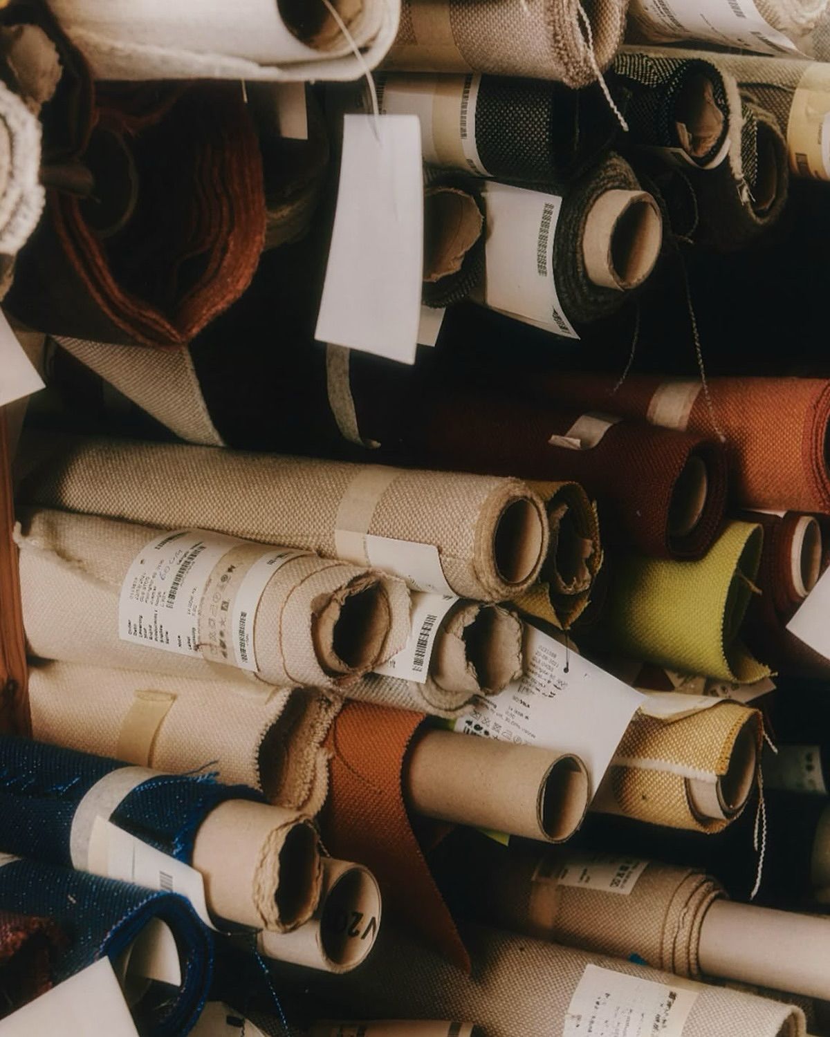 Surplus fabric rolls with inventory tags